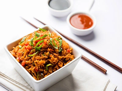 SCHEZWAN FRIED RICE (VEG – EGG – CHICKEN – MIXED)